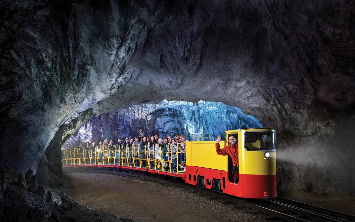 The electric underground train carrying visitors into Postojna Cave in Slovenia