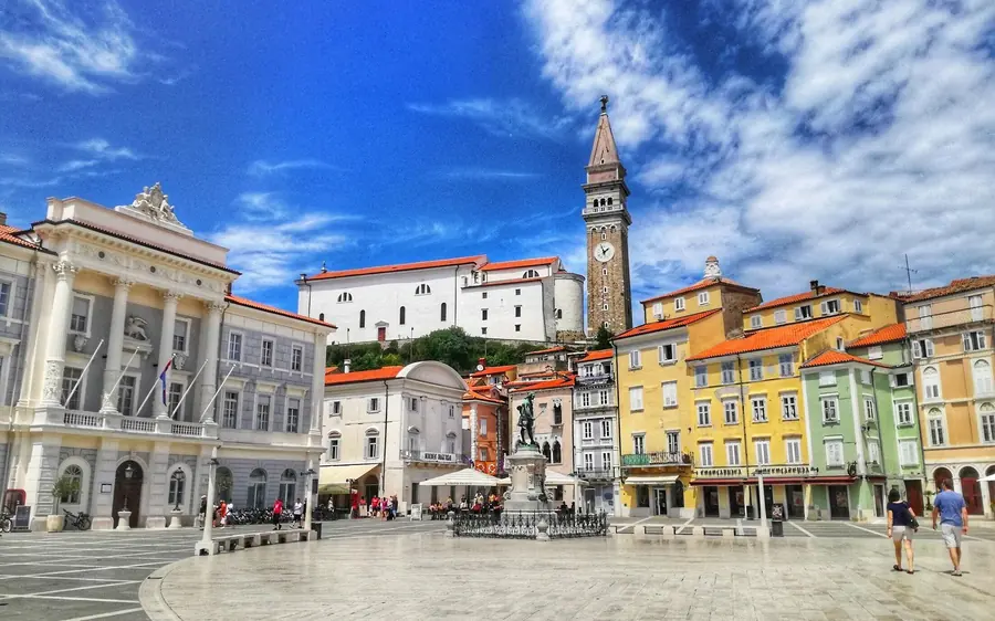 The colourful facades and bell tower of Tartini Square in the old town of Piran